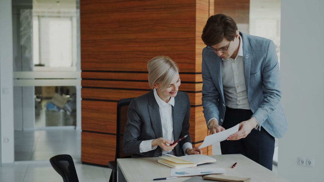 Finance documents and payroll paperwork on a professional desk — payroll process direction